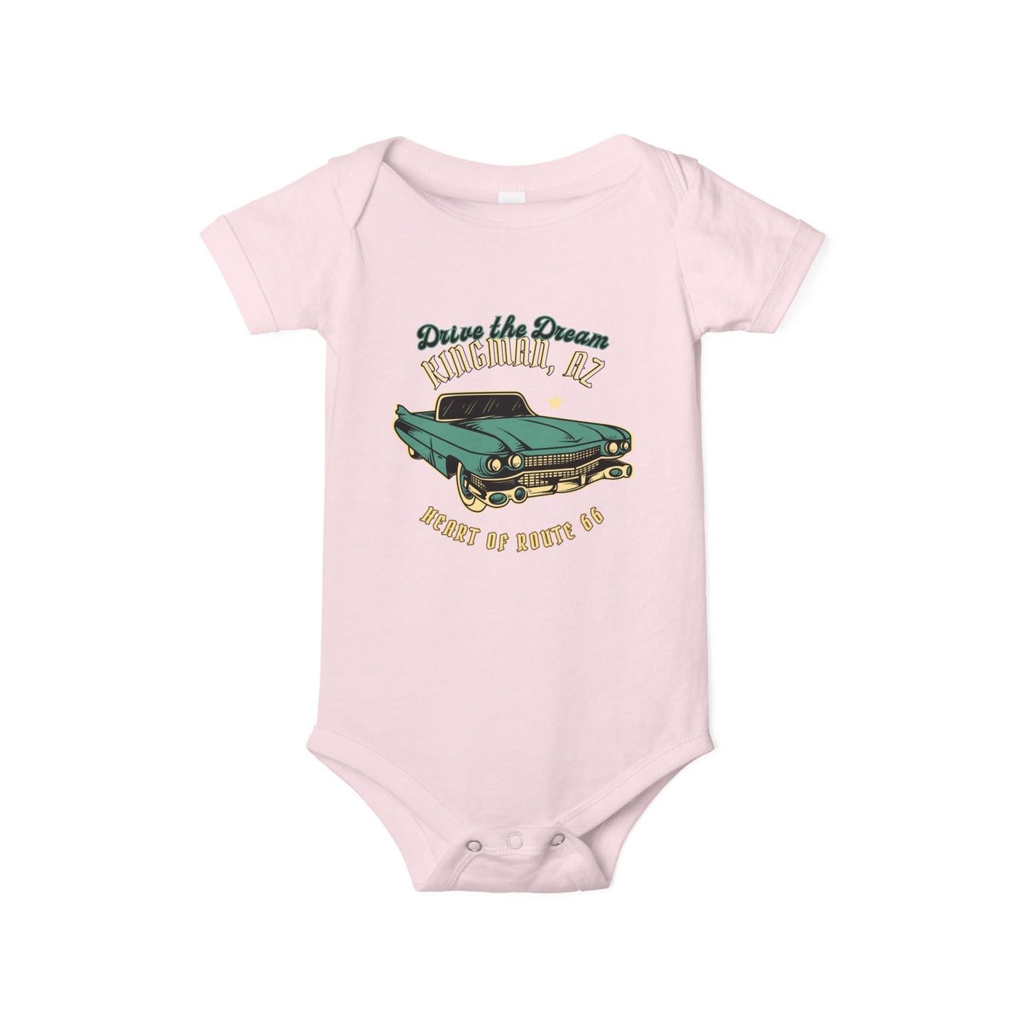 Flat lay of pink Route 66 baby bodysuit with vintage car and Kingman AZ Heart of Route 66 graphic