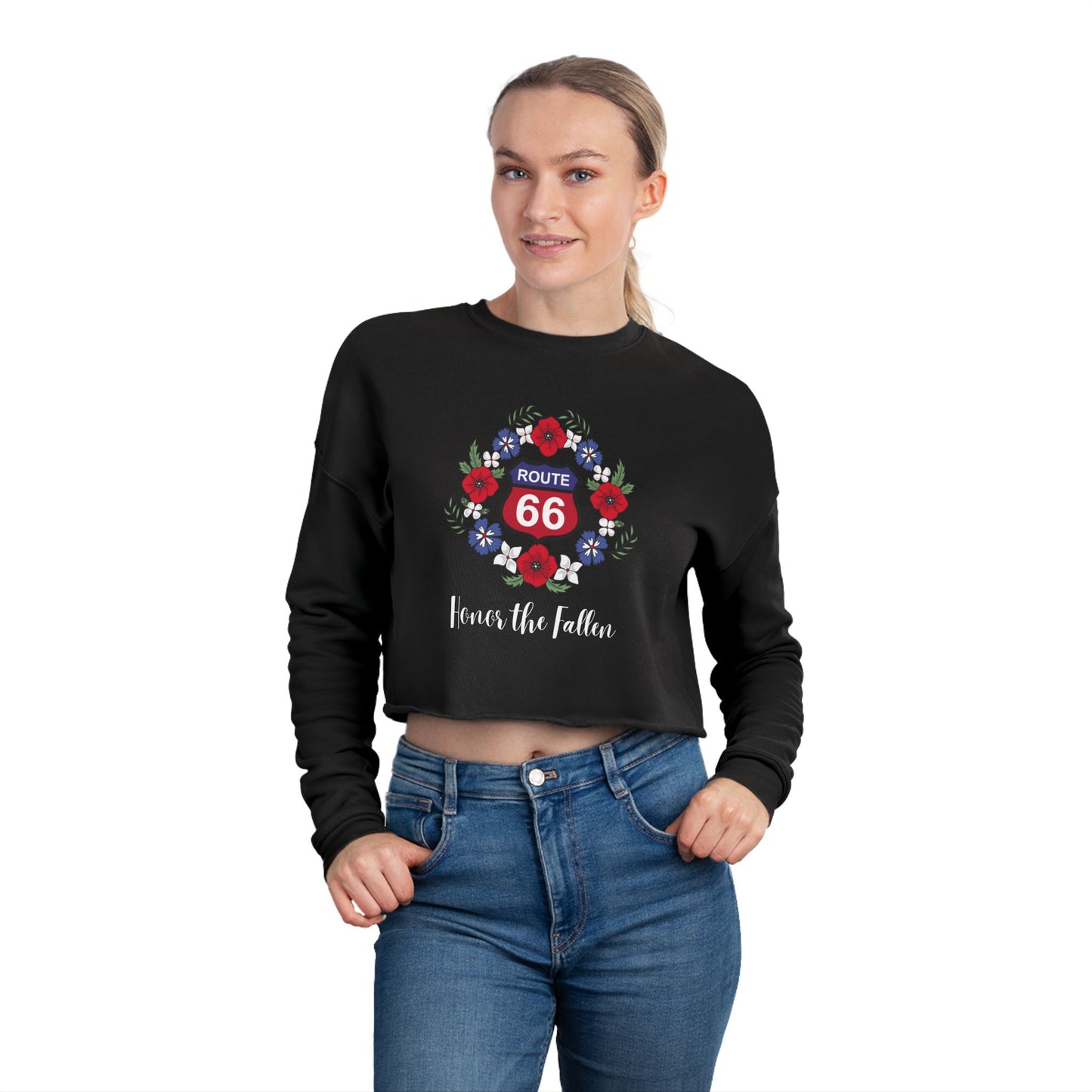 Closeup of Route 66 "Honor the Fallen" cropped sweatshirt showing a red and blue Route 66 shield, surrounded by a wreath of poppies and the phrase "Honor the Flalen" in a script font