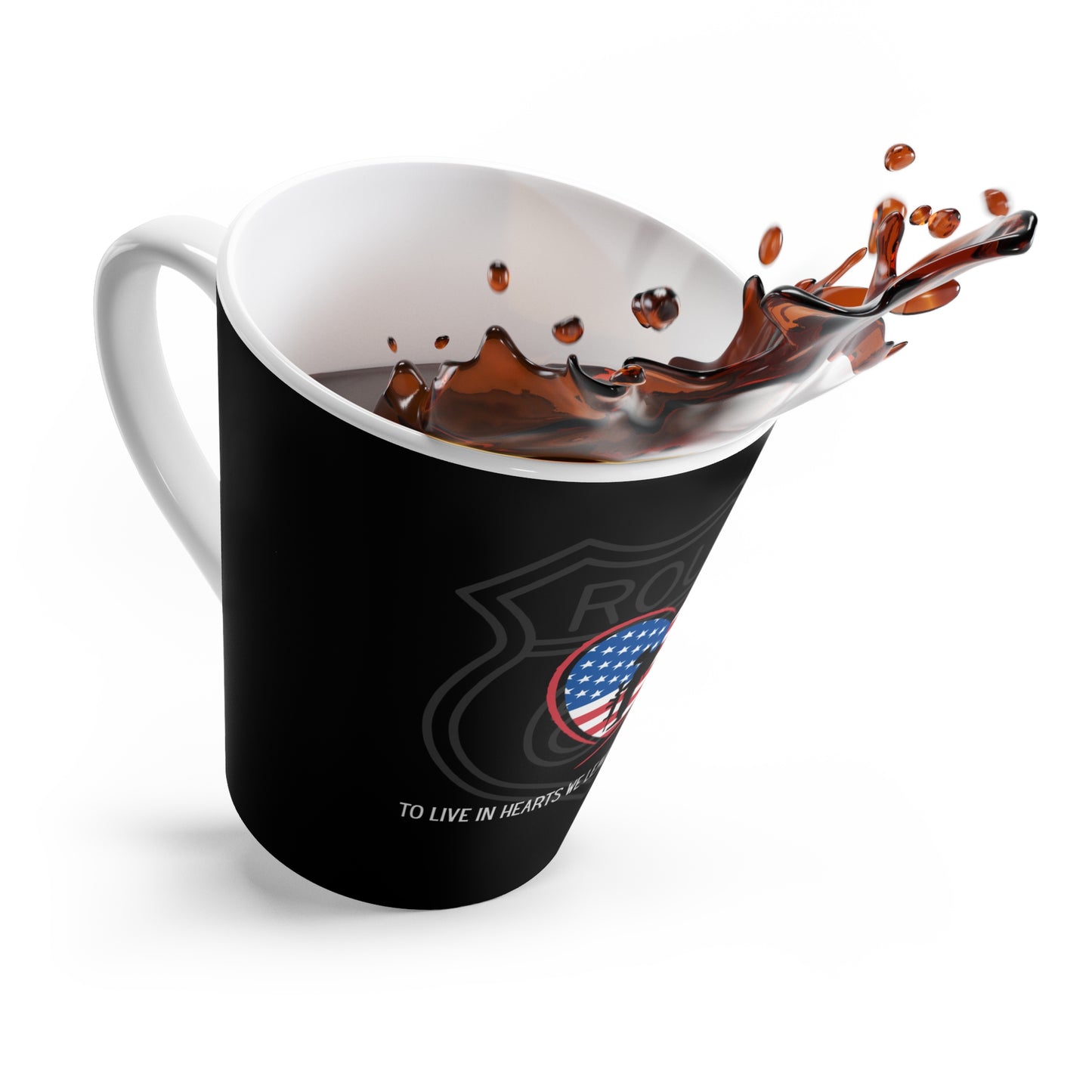 A dramatic, dynamic shot of a black, tapered black latte mug tilted to the side, with black coffee splashing high from the rim. The black latte mug features a Route 66 shield with a heart-shaped US flag, a and a Thomas Campbell quote.