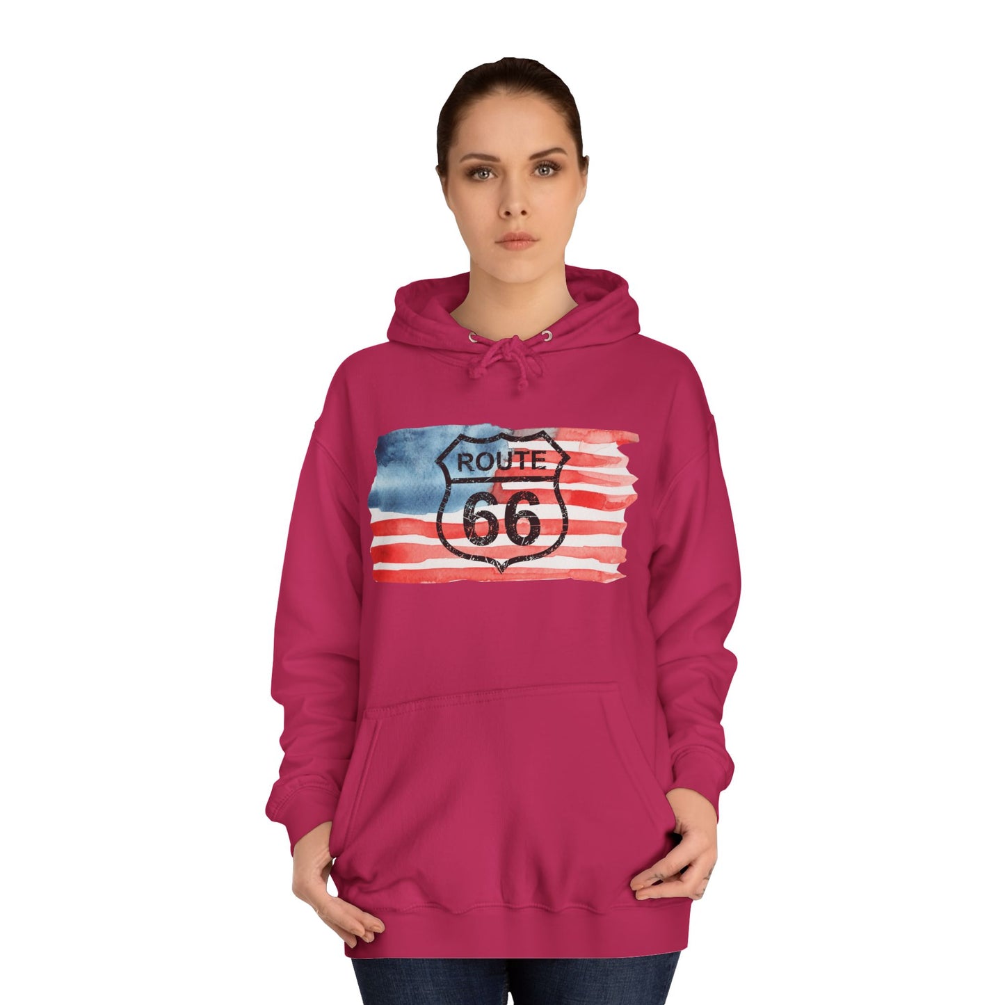 Woman wearing a hot pink Route 66 hoodie with a distressed American flag watercolor design across the chest, showcasing a bold Americana style