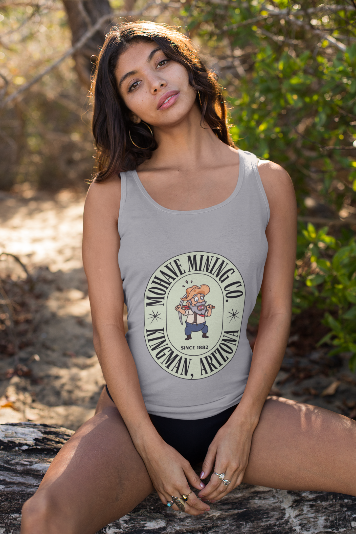 Woman wearing a Mohave Mining Co. athletic heather tank top outdoors, vintage Americana style inspired by Arizona mining history and Route 66 heritage.
