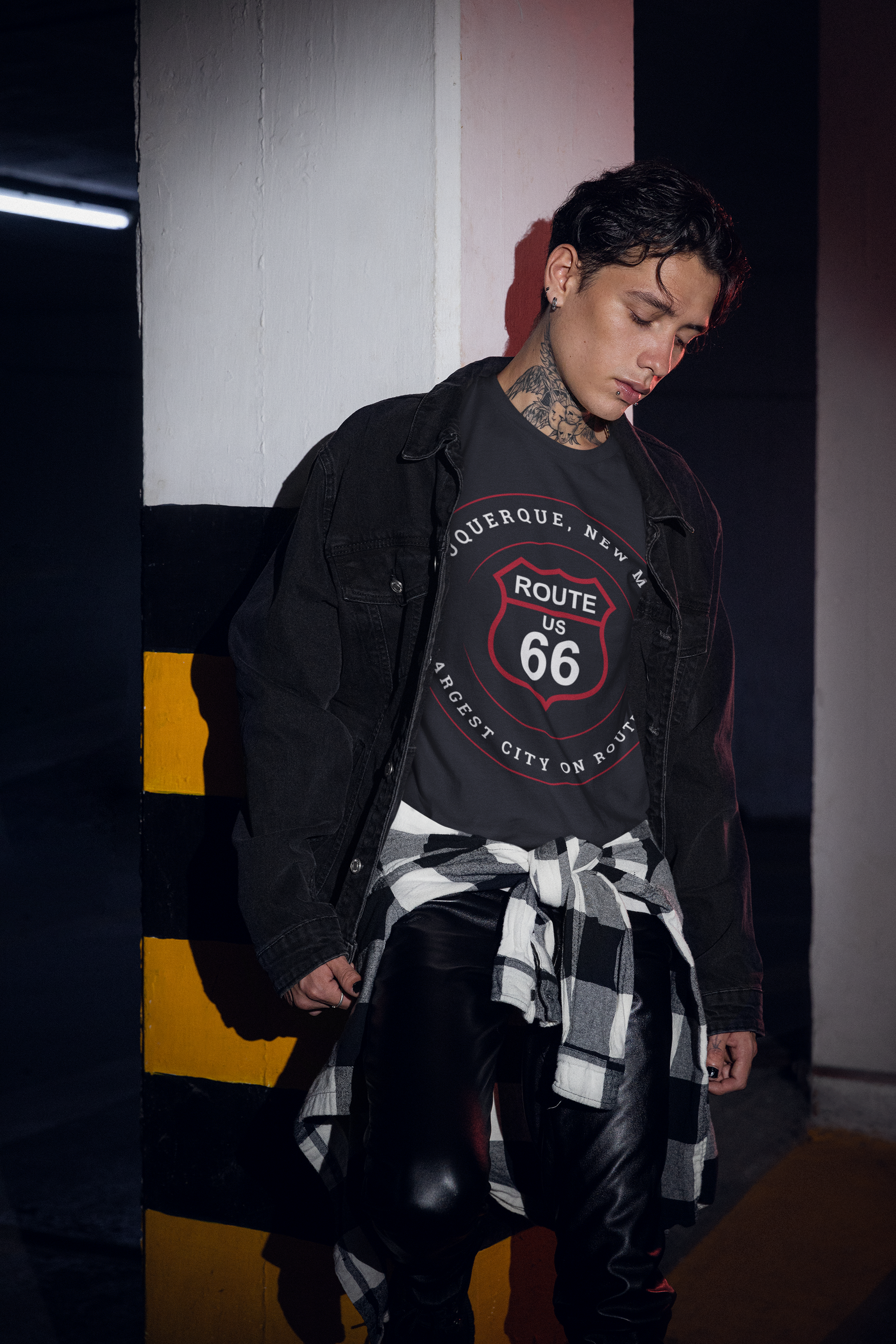 Male model wearing vintage black Retro Route 66 unisex jersey tee with Albuquerque, NM: Largest City on Route 66 graphic.