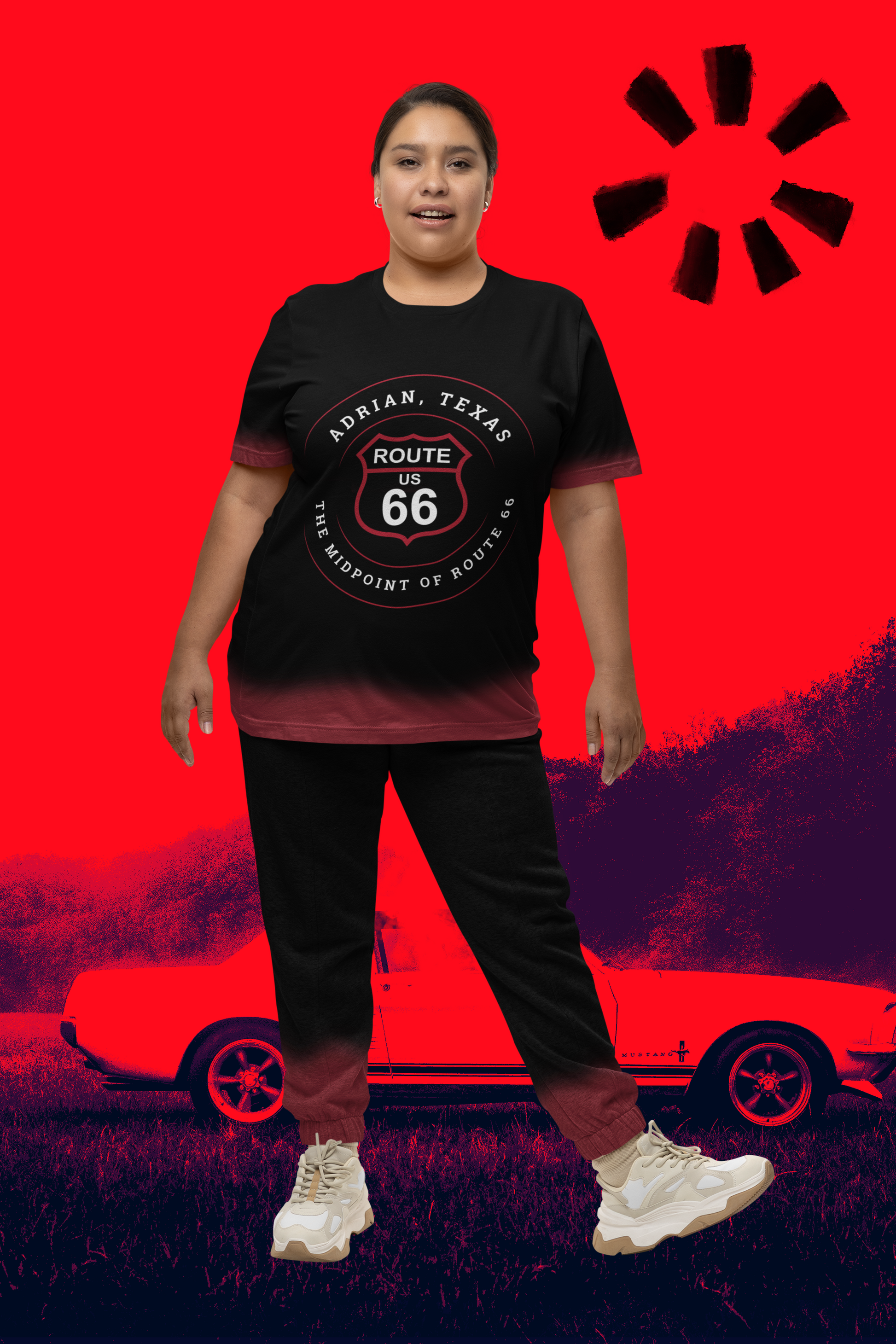 Female model wearing black retro Route 66 unisex jersey tee with Adrian, TX: "The Midpoint of Route 66" design with artistic red image with sports car in the background