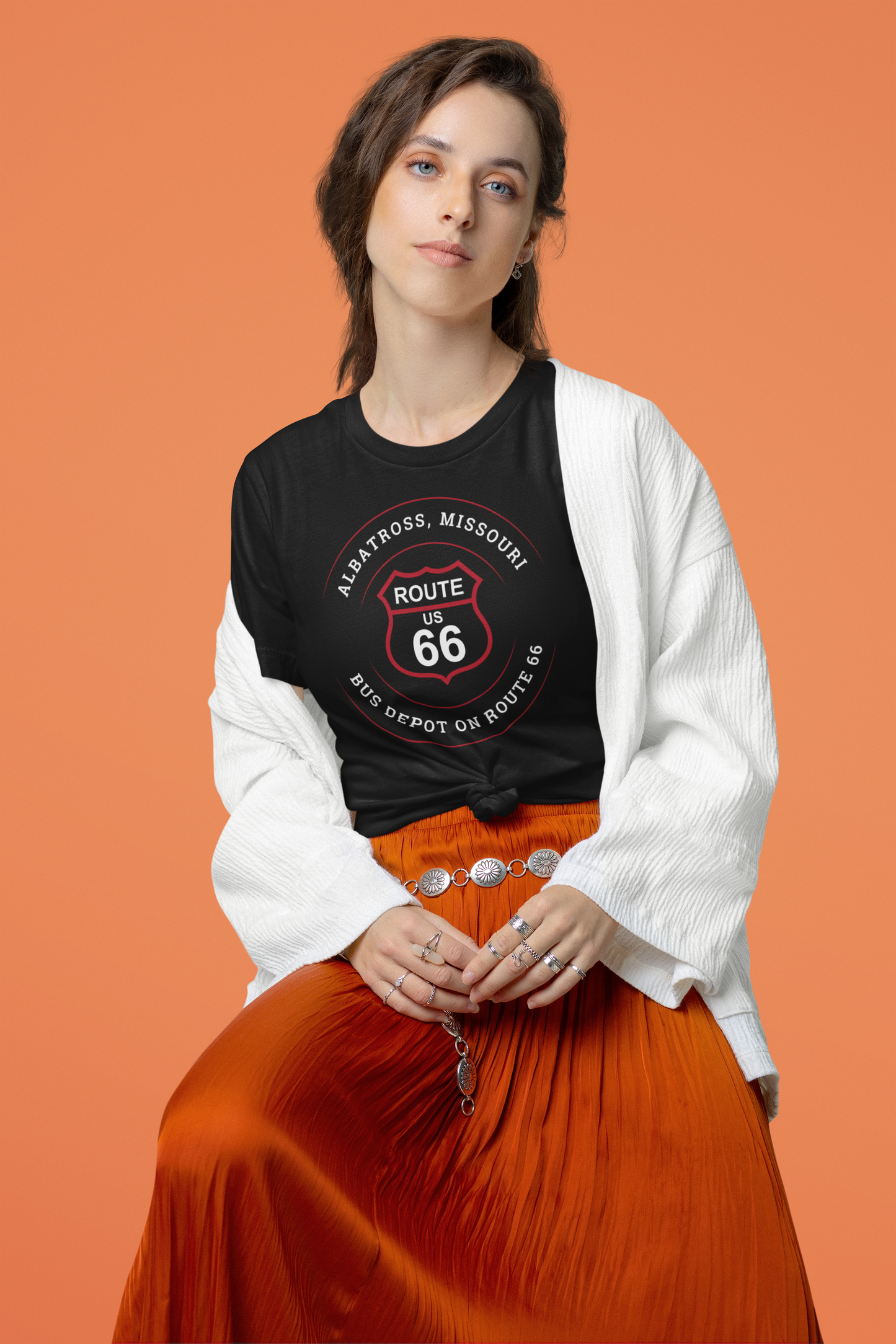 Female model wearing black retro Route 66 unisex jersey tee with Albatross, MO "Bus Depot on Route 66" design