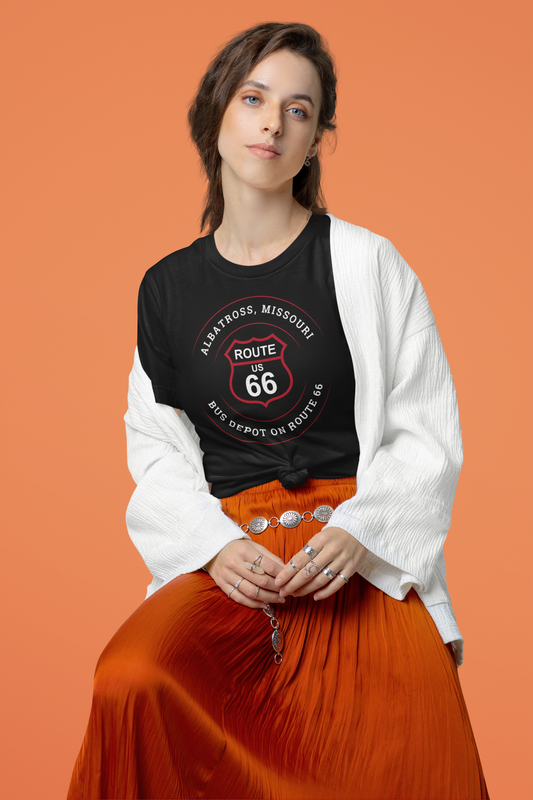 Female model wearing black retro Route 66 unisex jersey tee with Albatross, MO "Bus Depot on Route 66" design