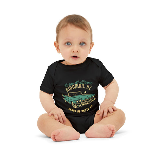 Baby wearing black Route 66 vintage car bodysuit with Kingman, AZ "Heart of Route 66" design, sitting on Route 66 blanket