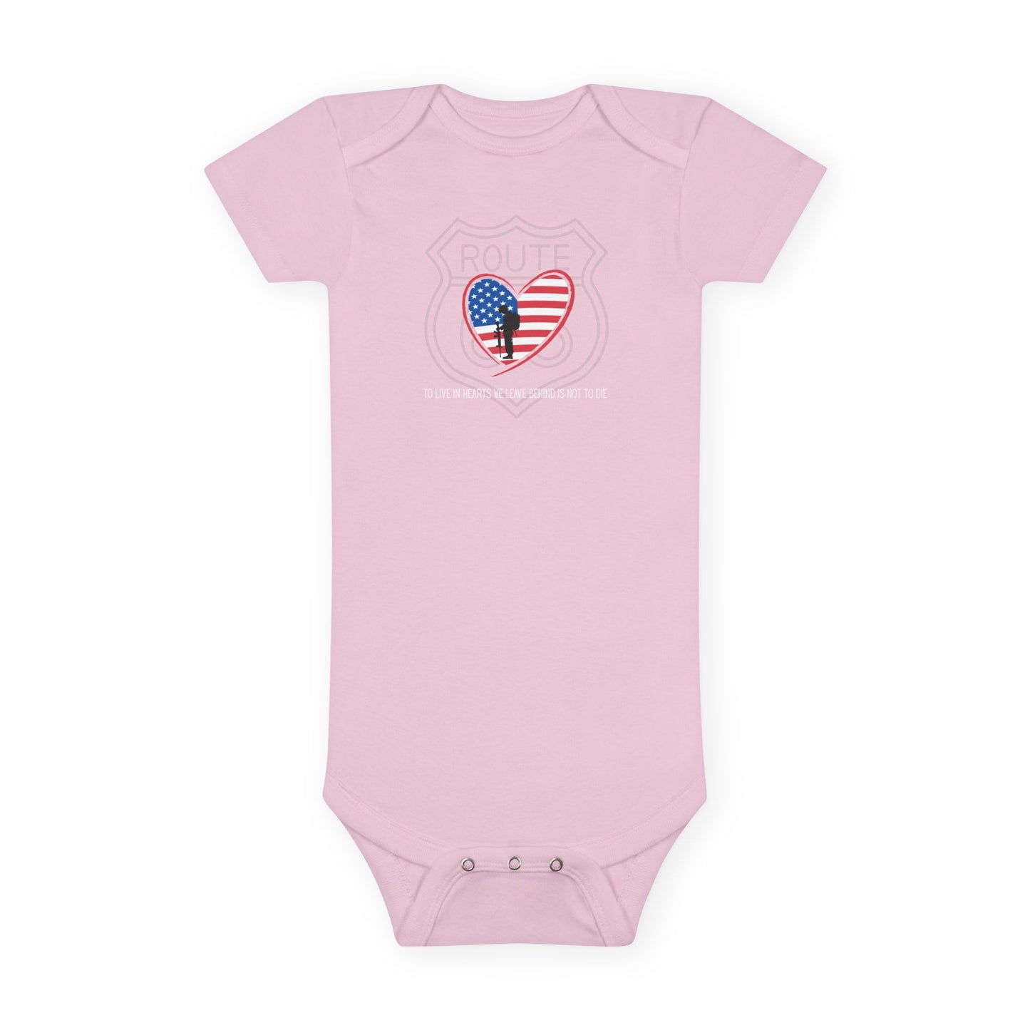 Flat lay of pink Route 66 baby onesie with heart-shaped American flag and fallen soldier design, showing lap shoulder neckline and snap closure detail.