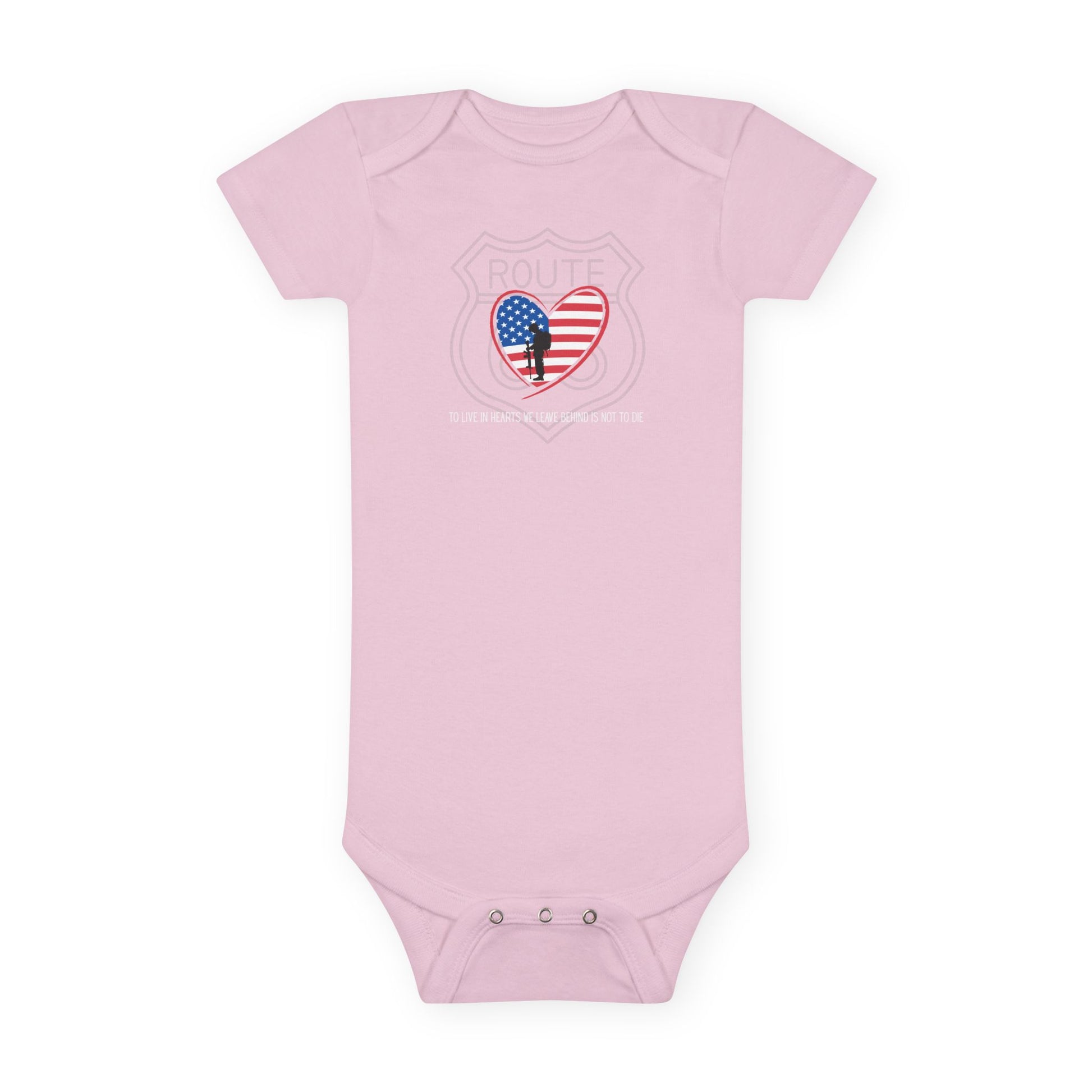 Flat lay of pink Route 66 baby onesie with heart-shaped American flag and fallen soldier design, showing lap shoulder neckline and snap closure detail.