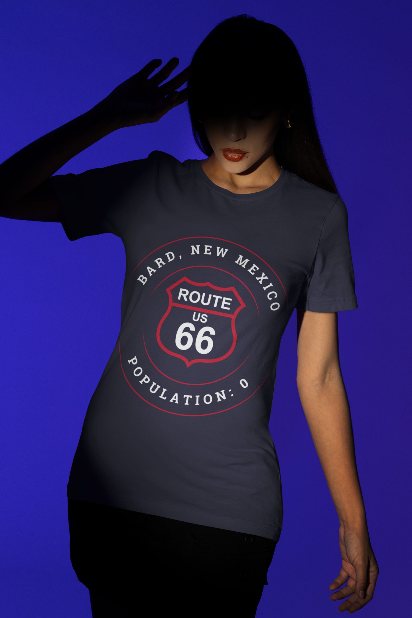 Female model wearing heather true royal retro Route 66 unisex jersey tee with Bard, NM: Population: 0 graphic