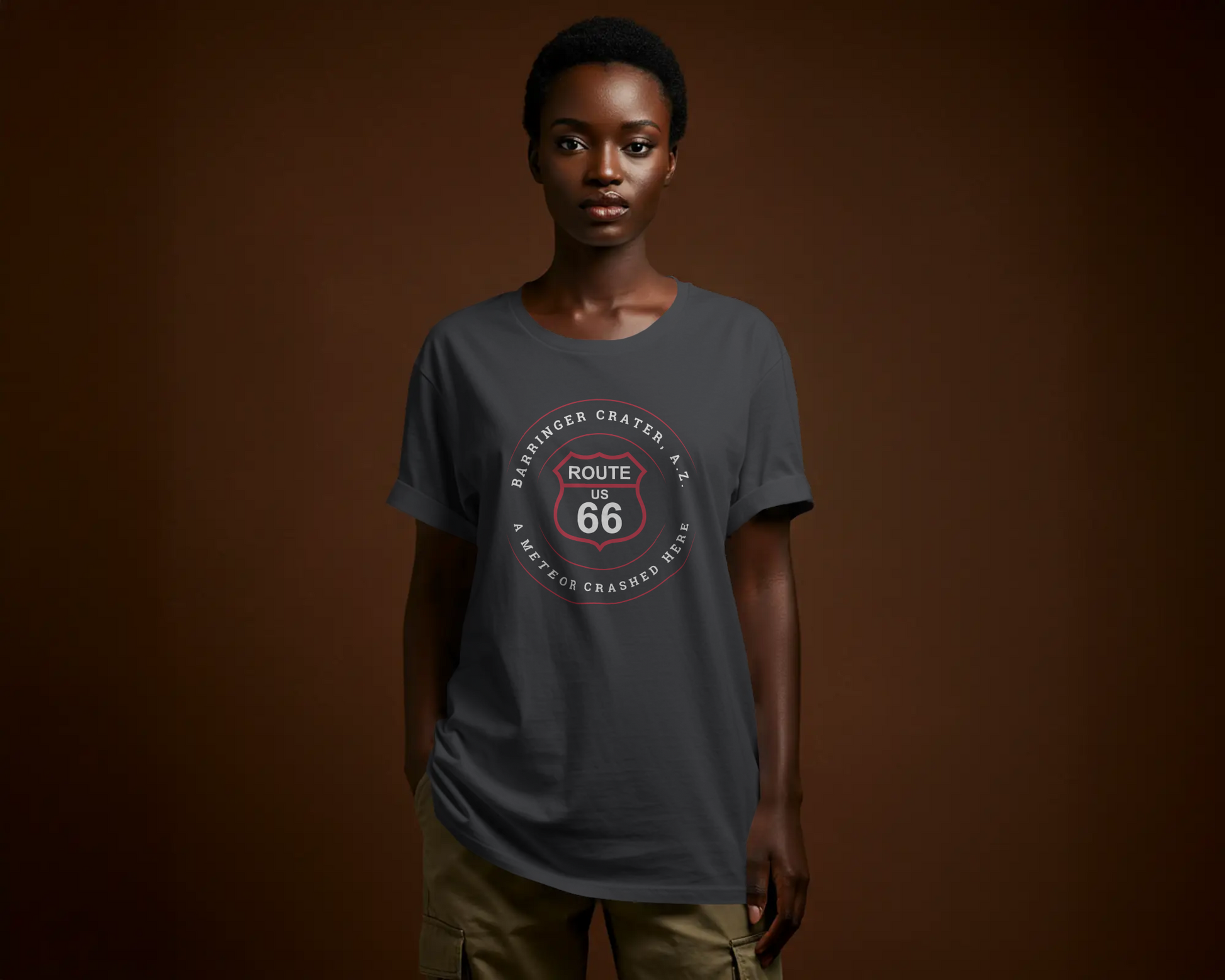 Female model wearing a vintage black retro Route 66 unisex jersey tee with Barringer Crater, AZ: "A Meteor Crashed Here" design