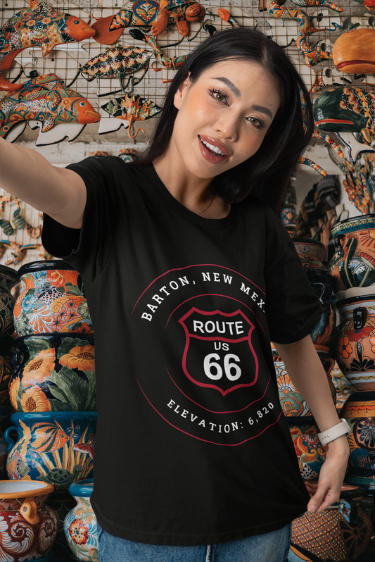 Female model wearing black retro Route 66 unisex jersey tee with Barton, NM: Elevation: 6,820 graphic