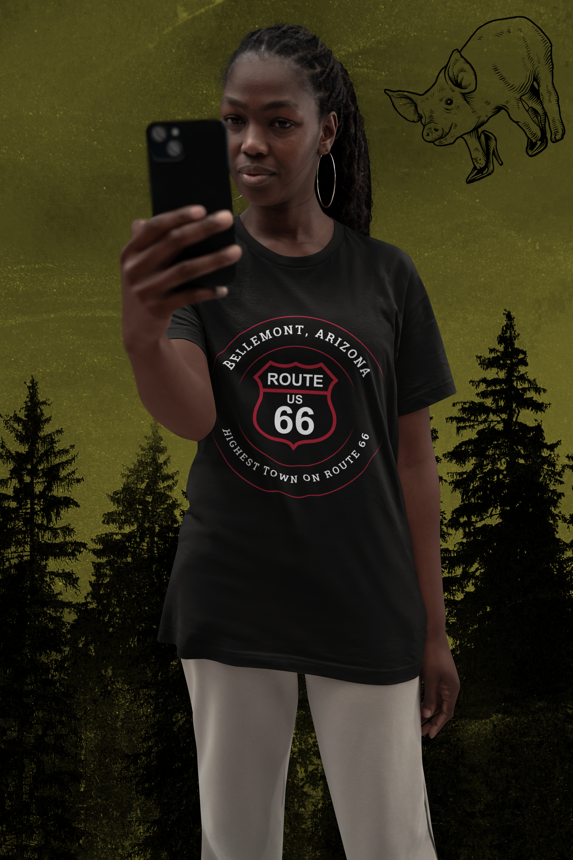 Female model wearing black heather retro Route 66 unisex jersey tee with Bellemont, AZ: "Highest Town on Route 66" design with the 