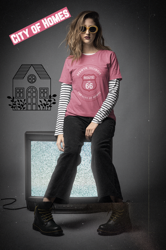Female model wearing sunglasses and a heather raspberry retro Route 66 unisex jersey tee with a Berwyn, IL:: "City of Homes" design
