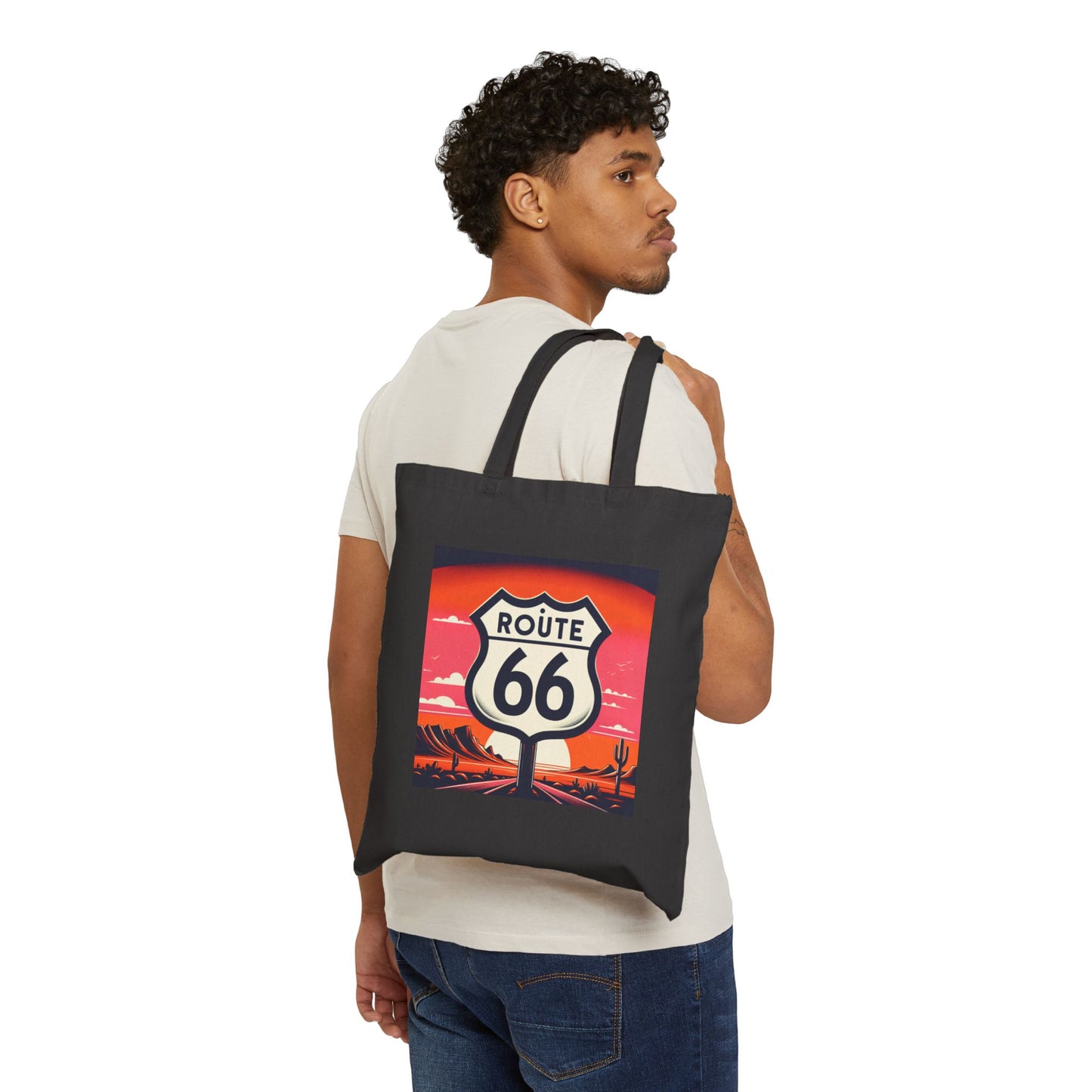 Man wearing a black Route 66 canvas tote bag with desert sunset design, casual vintage travel fashion