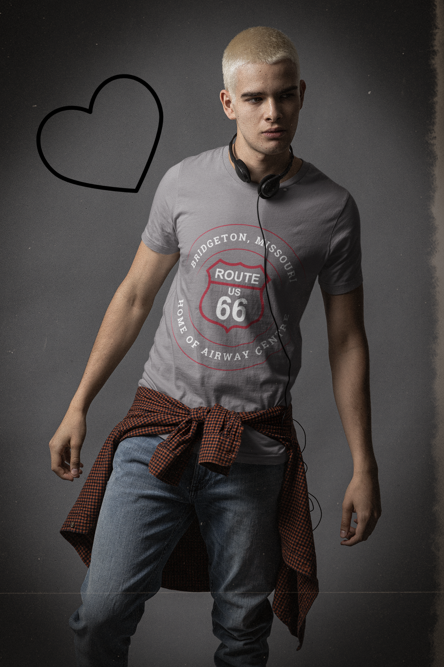 Male model wearing a grey retro Route 66 unisex jersey tee with a Bridgeton, MO: "Home of Airway Centre" design