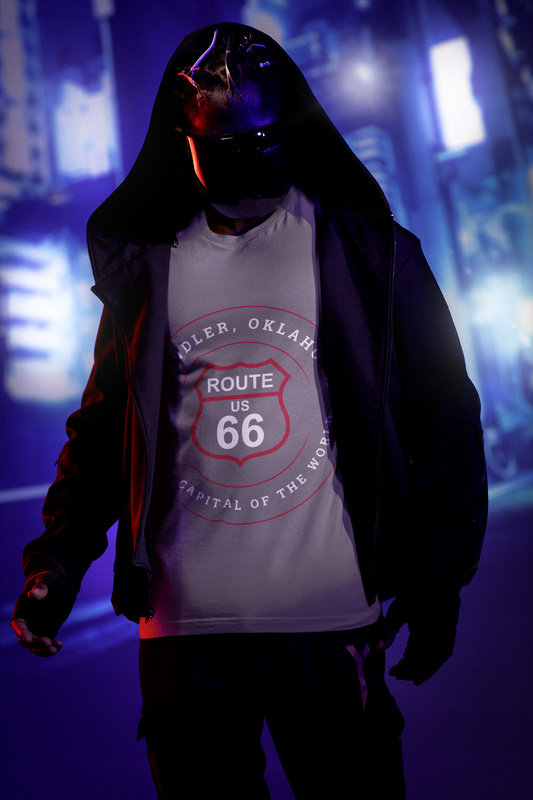 Male model with a face mask and dark jacket stands in the Chandler street. He is wearing a dark grey heather retro Route 66 unisex jersey tee with Chandler, OK "Pecan Capital of the World" design