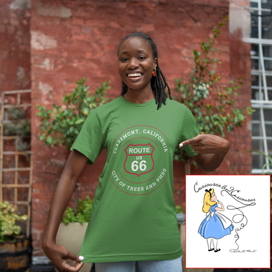 Female model wearing leaf retro Route 66 unisex jersey tee with Claremont, CA: "City of Trees and PhDs" design and a Alice in Wonderland drawing on the bottom right