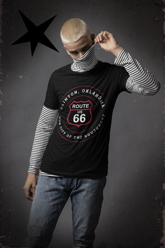 Male model wearing a black retro Route 66 unisex jersey tee with a Clinton, OK: "Hub City of the Southwest" design