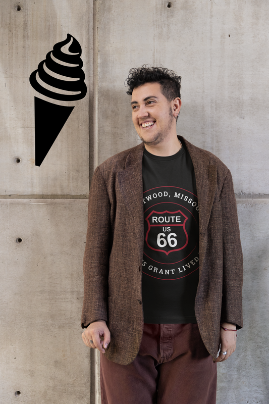 Male model wearing a brown jacket and a black retro Route 66 unisex jersey tee with a Crestwood, MO: "Ulysses Grant Lived Here" design