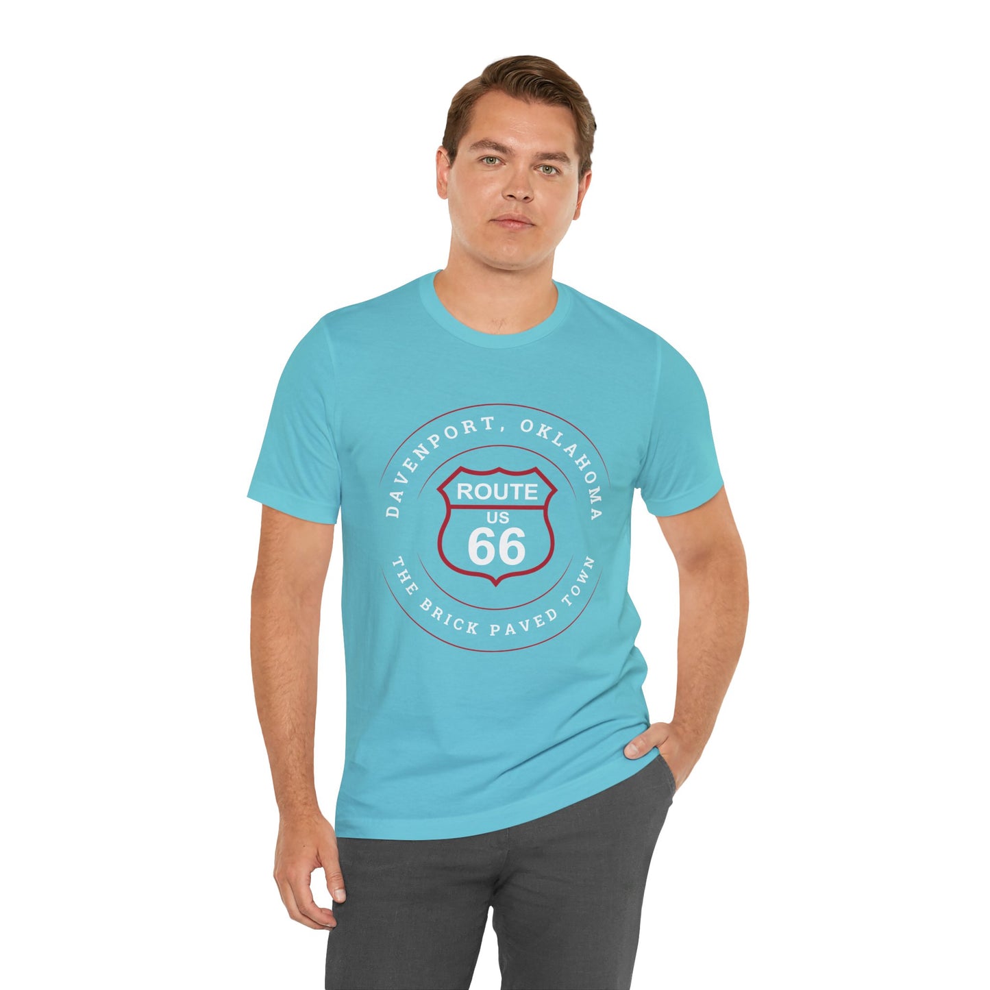 Male model wearing a turquoise retro Route 66 unisex jersey tee with Davenport, OK "The Brick-Paved Town" design