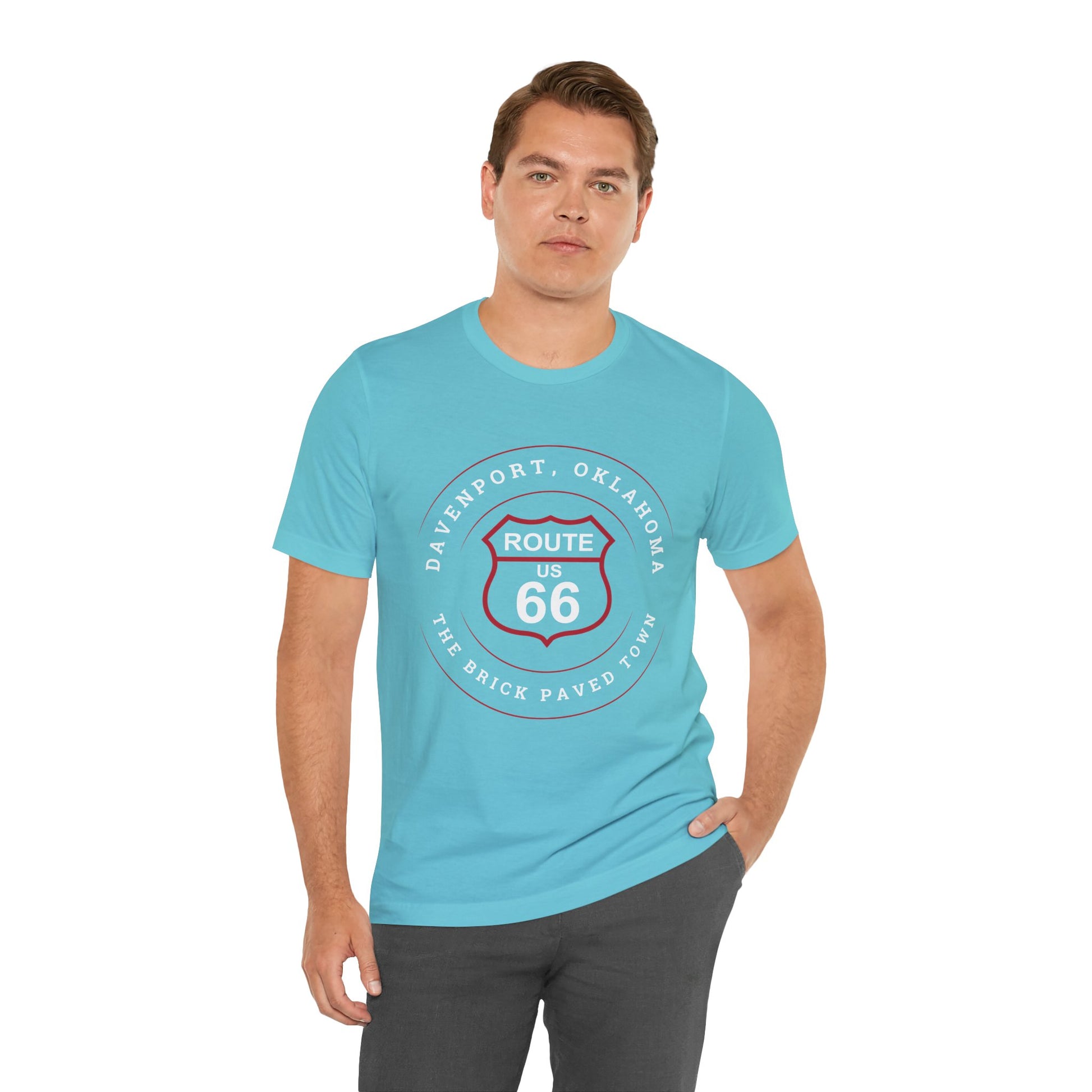 Male model wearing a turquoise retro Route 66 unisex jersey tee with Davenport, OK "The Brick-Paved Town" design