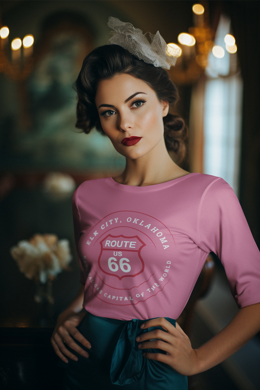 Female model wearing heather raspberry retro Route 66 unisex jersey tee with Elk City, OK "Natural Gas Capital of the World" design