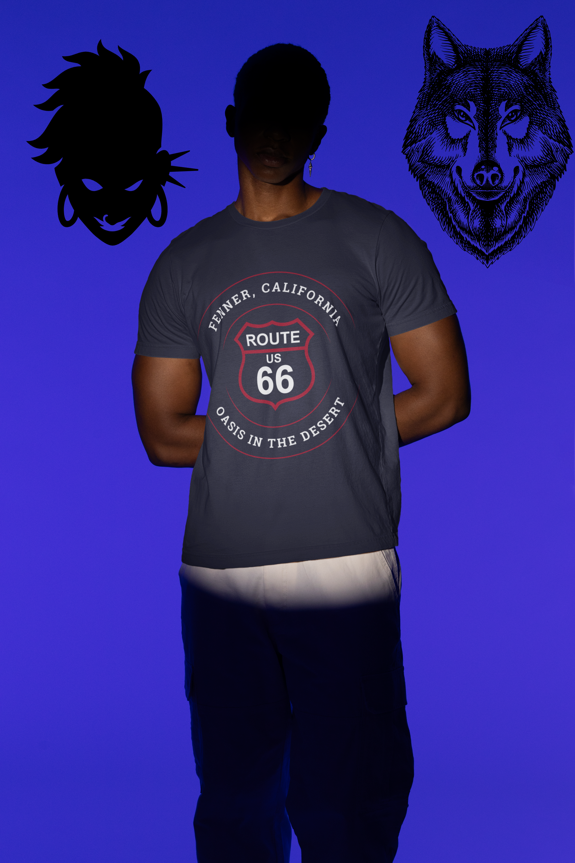 Male model, whose face is hidden in the shadows, is wearing team navy retro Route 66 unisex jersey tee with Fenner, CA: "Oasis in the Desert" design