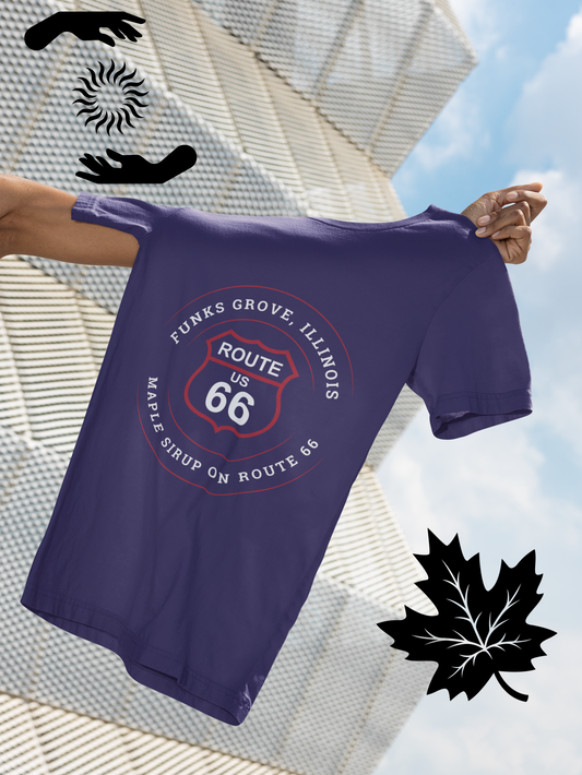 Female model, whom is outside of the picture, is holding a heather team  purple retro Route 66 unisex jersey tee with a Funks Grove, IL: "Maple Sirup on Route 66" design
