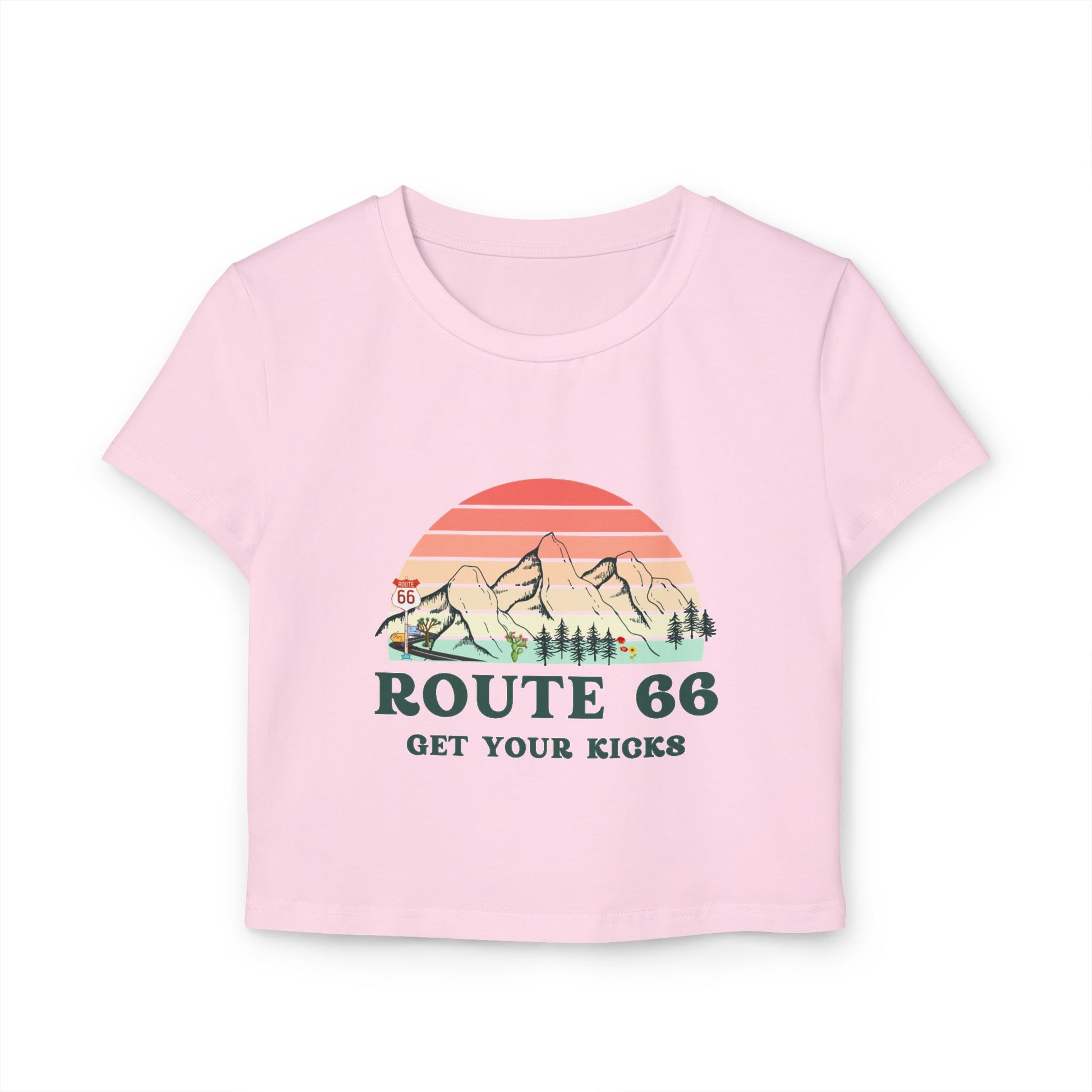Light pink Route 66 "Get Your Kicks" women's baby tee with vintage sunset and mountain graphic, flat lay view.