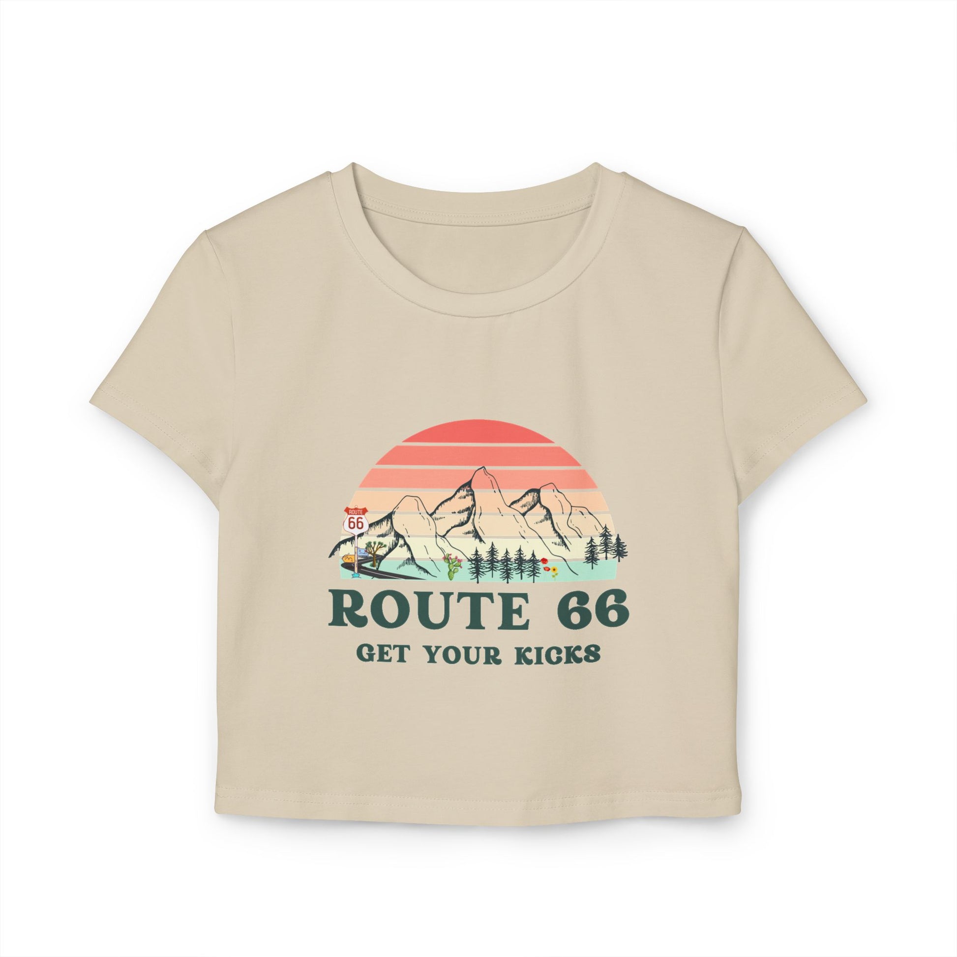 Sand Route 66 "Get Your Kicks" women's baby tee with vintage sunset and mountain graphic, flat lay view.