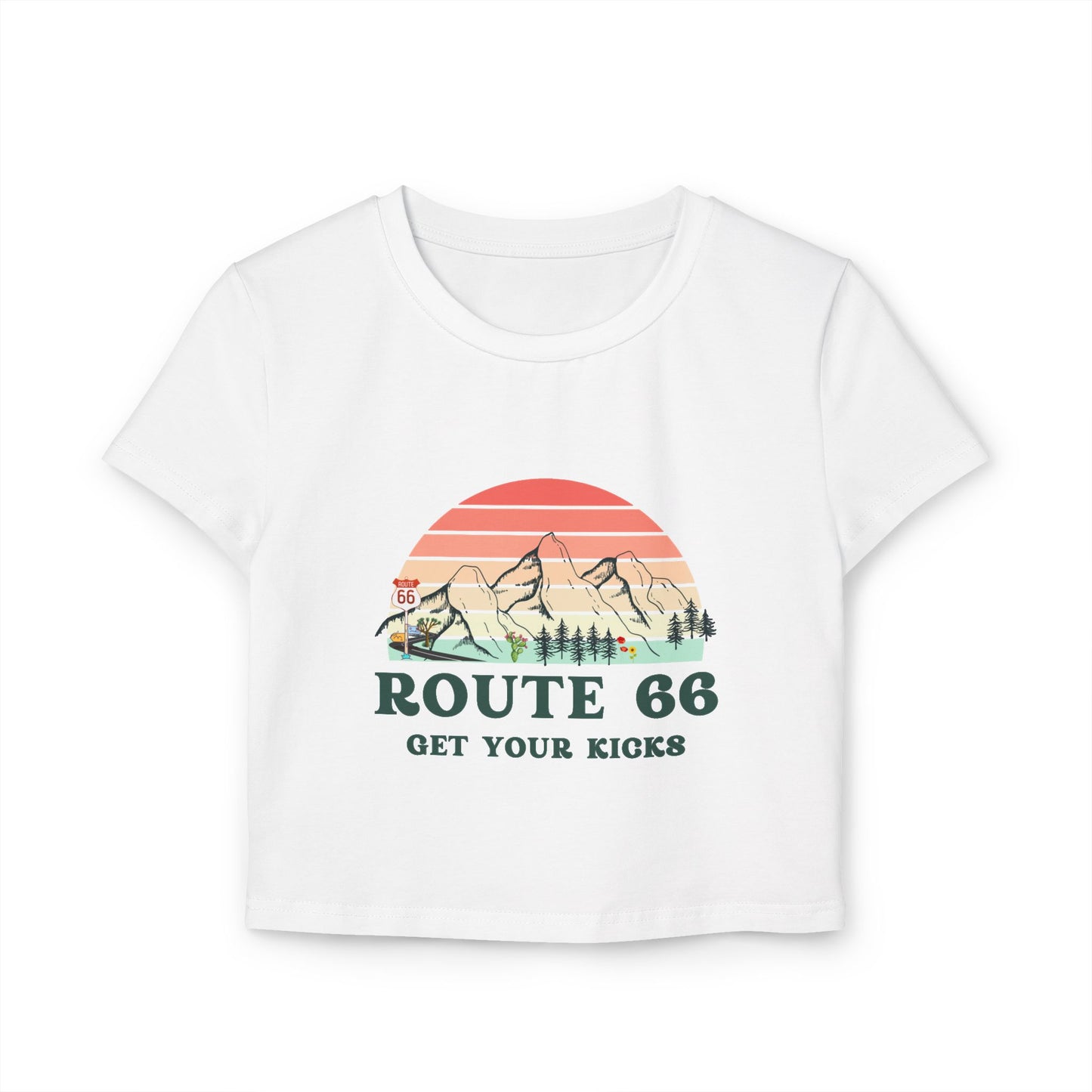 White Route 66 "Get Your Kicks" women's baby tee with vintage sunset and mountain graphic, flat lay view.