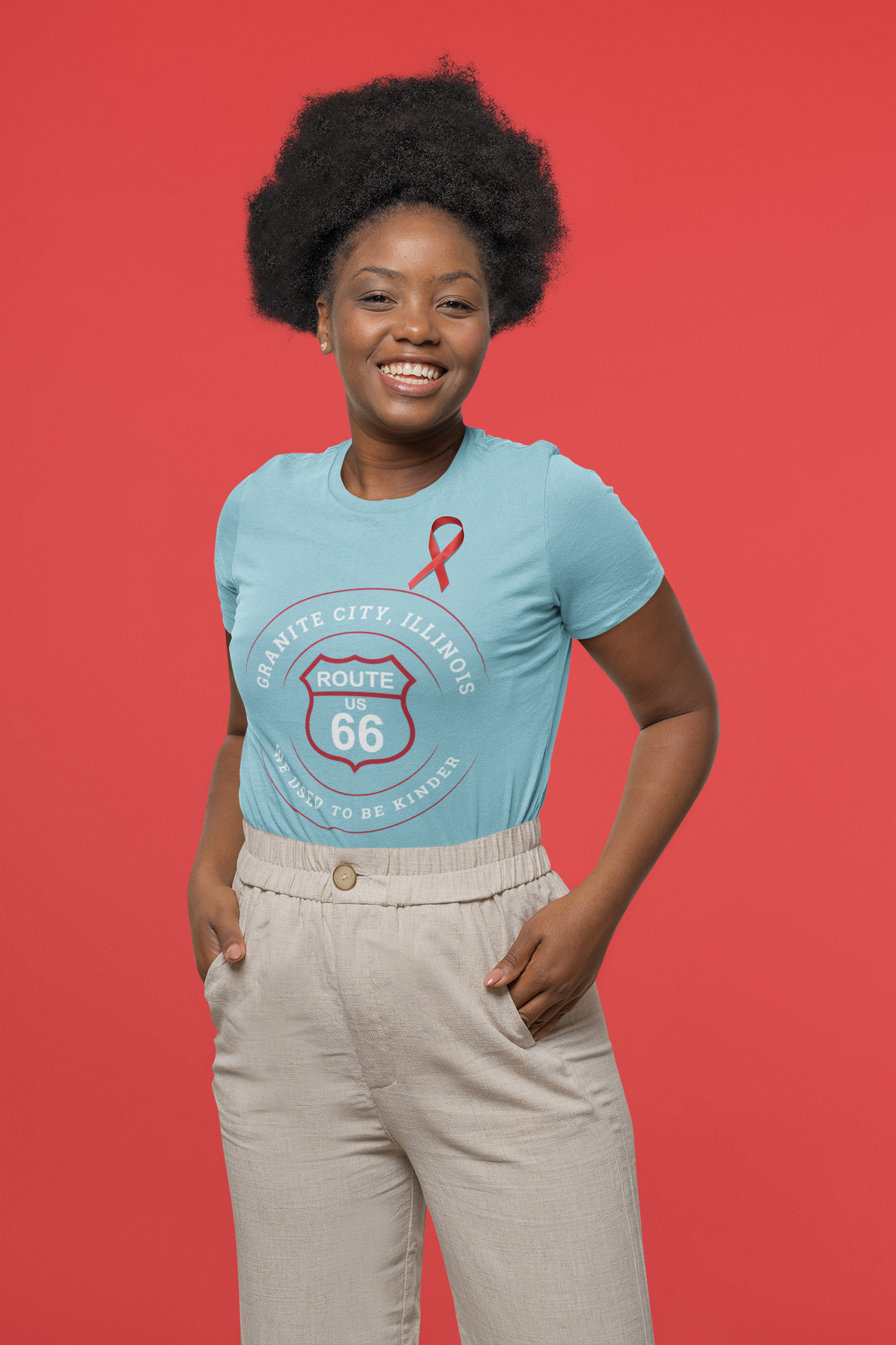 Female model wearing a turquoise retro Route 66 unisex jersey tee with a Granite City, IL:: "We Used to be Kinder" design