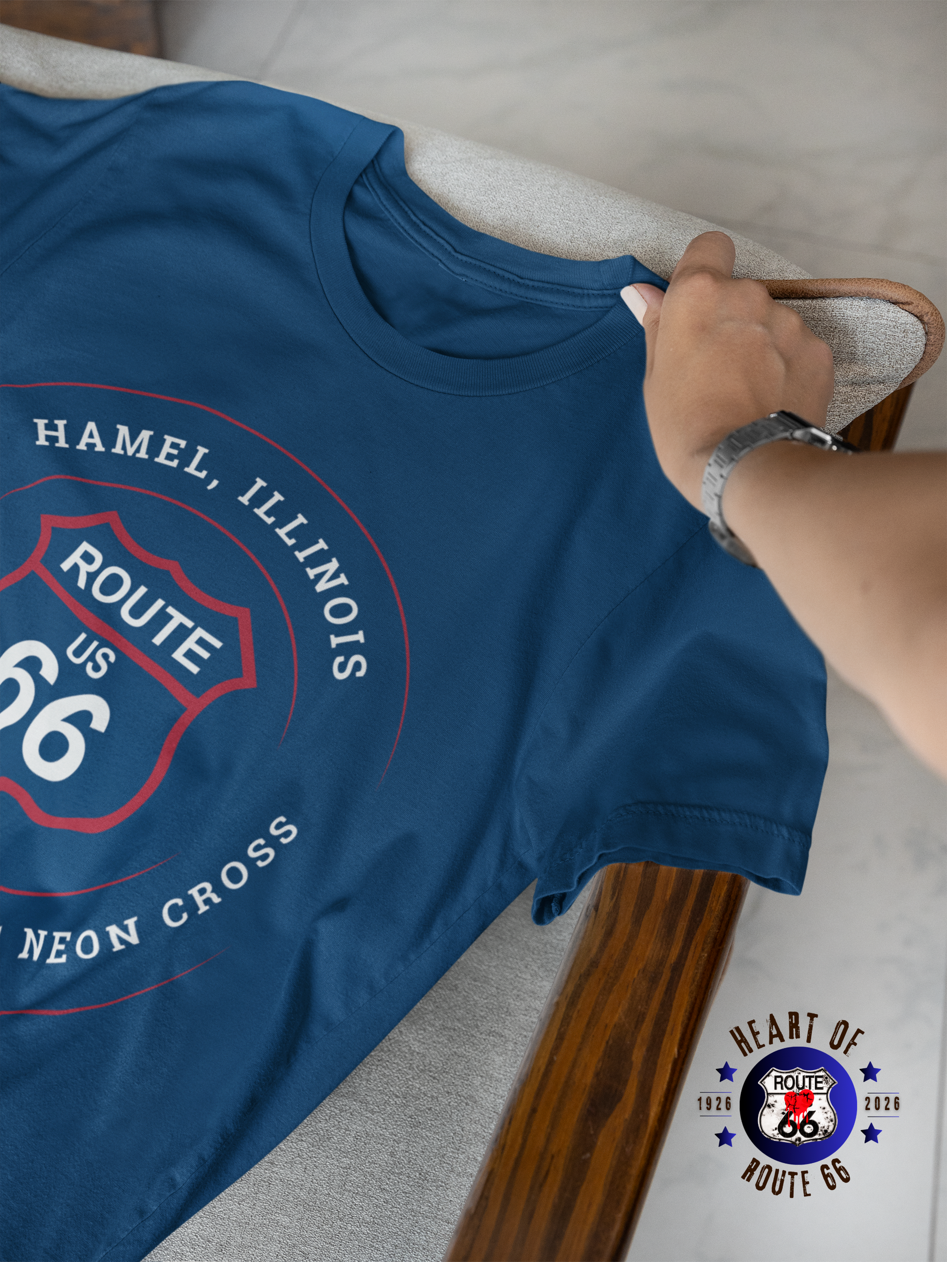 A displayed heather true royal retro Route 66 unisex jersey tee with a Hamel, IL:: "Site of the Church of the Neon Cross" design