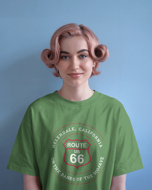 Female model wearing leaf retro Route 66 unisex jersey tee with Helendale, CA: "On the Banks of the Mojave" design