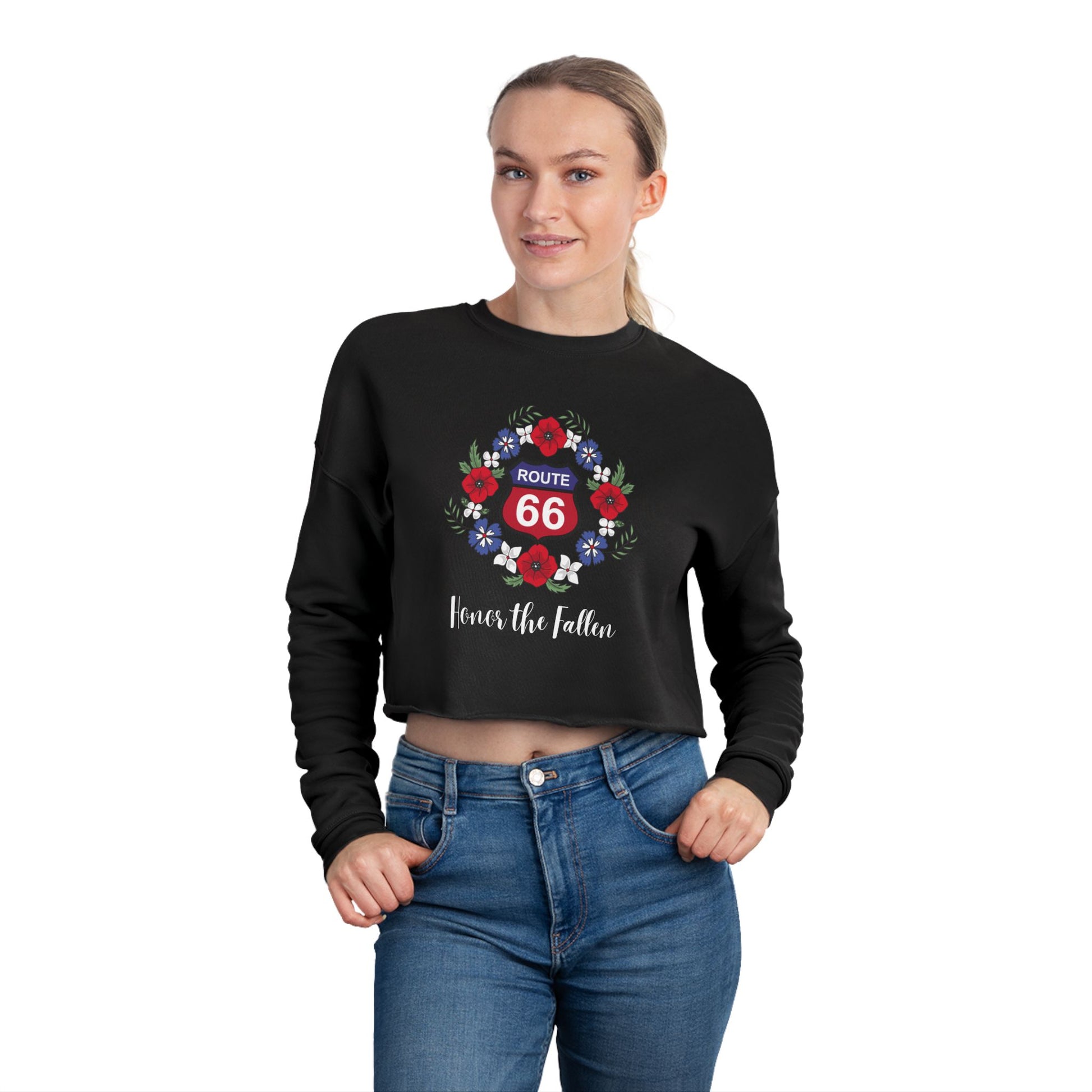 Closeup of Route 66 "Honor the Fallen" cropped sweatshirt showing a red and blue Route 66 shield, surrounded by a wreath of poppies and the phrase "Honor the Flalen" in a script font