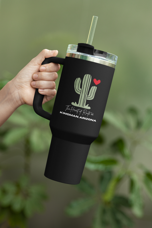 Person holding Route 66 cactus travel mug with Kingman, Arizona design, eco-friendly insulated tumbler.