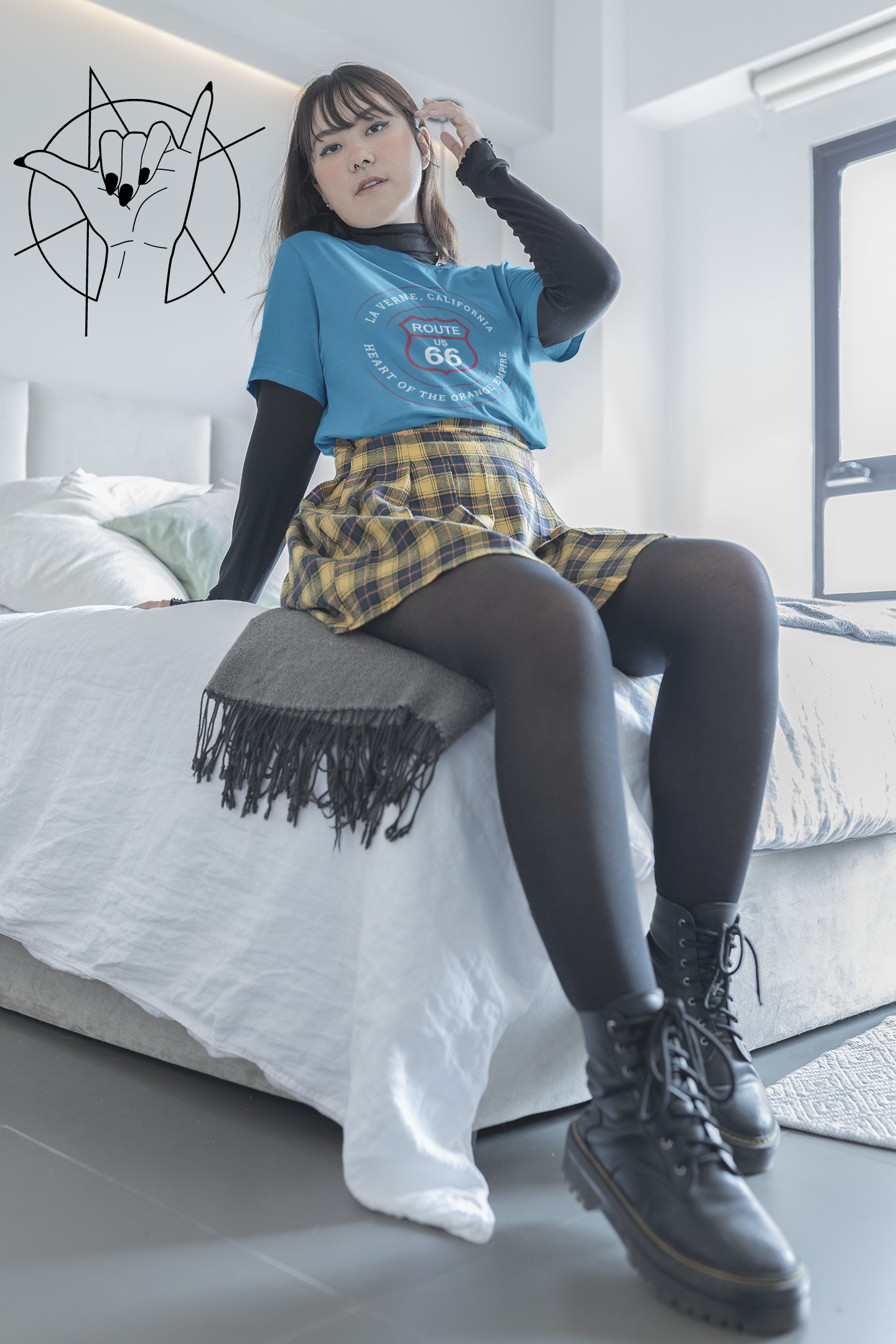 Female model wearing an aqua retro Route 66 unisex jersey tee with La Verne, CA: "Heart of the Orange Empire" design