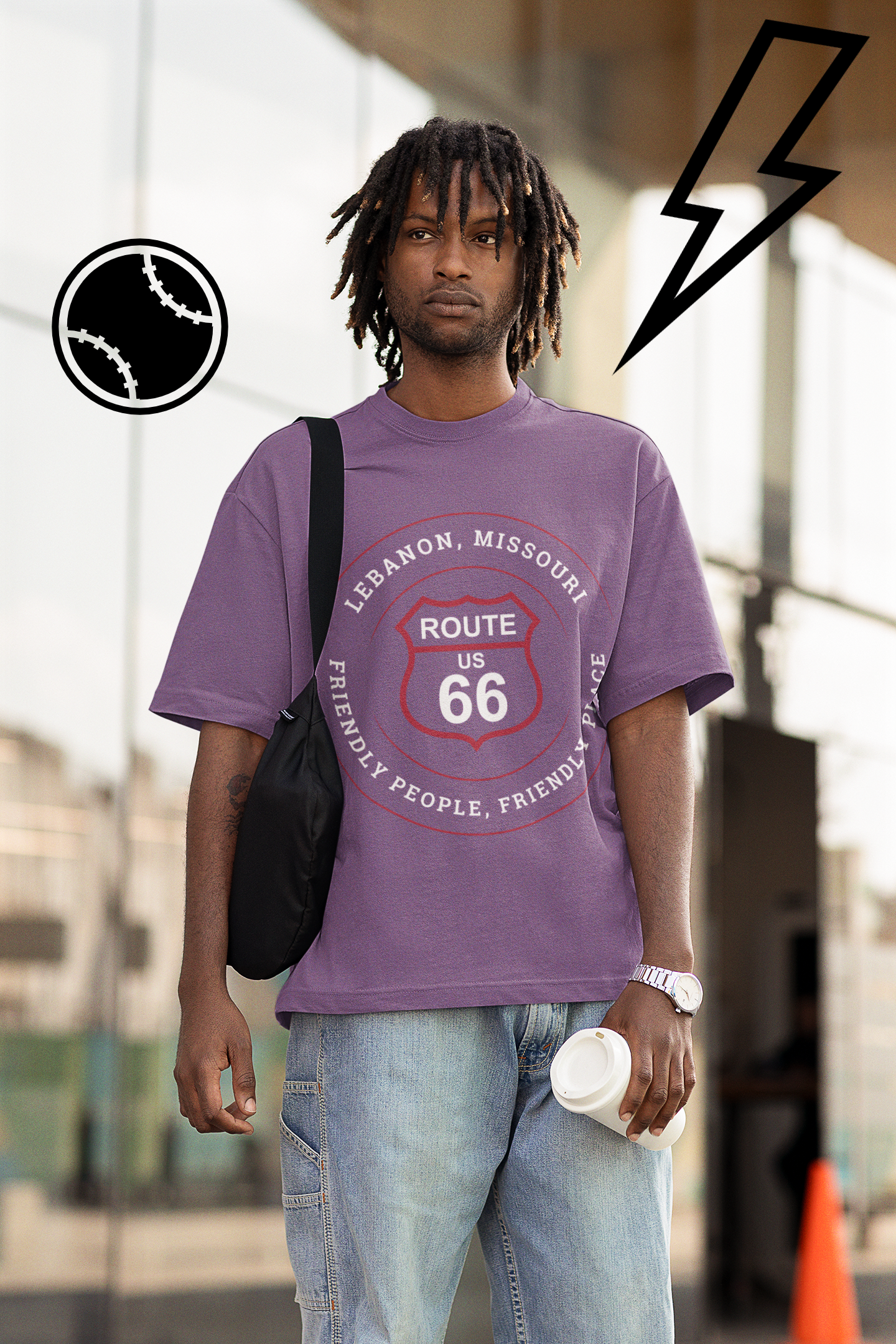 Male model wearing a heather team purple retro Route 66 unisex jersey tee with a Lebanon, MO "Friendly People, Friendly Place" design
