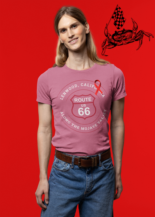 Male model wearing heather raspberry retro Route 66 unisex jersey tee with Lenwood, CA: "Along the Mojave Valley" design against a red background with a crab holding a race flag illustration in the top right corner