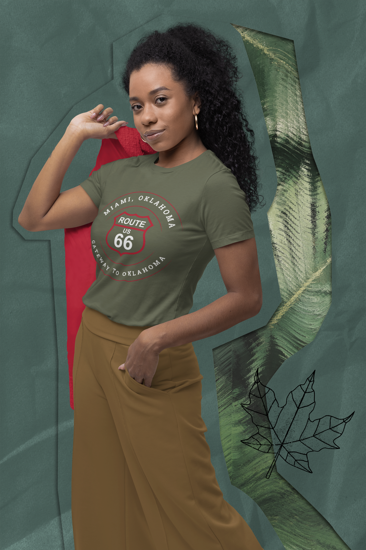 Female model wearing heather military green retro Route 66 unisex jersey tee with Miami, OK "Gateway to Oklahoma"  design