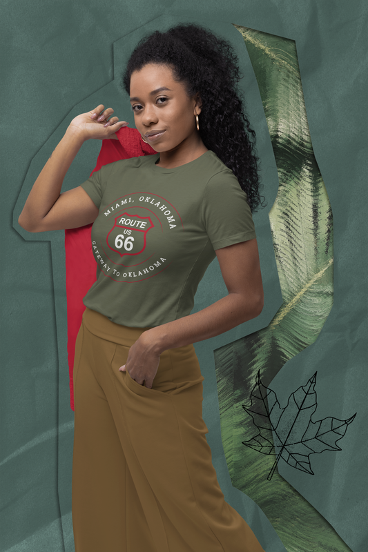 Female model wearing heather military green retro Route 66 unisex jersey tee with Miami, OK "Gateway to Oklahoma"  design