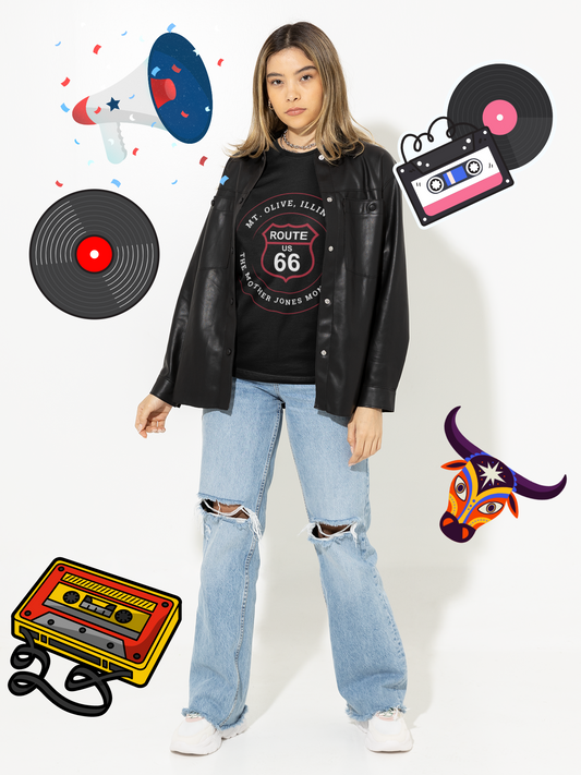 A female model wears a black unisex t-shirt with a retro Route 66 shield design for Mt. Olive, IL, labeled "Mother Jones Monument."