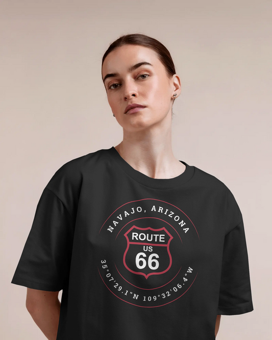 Female model wearing vintage black retro Route 66 unisex jersey tee with Navajo, AZ: "35°07'29.1"N 109°32'06.4"W" design