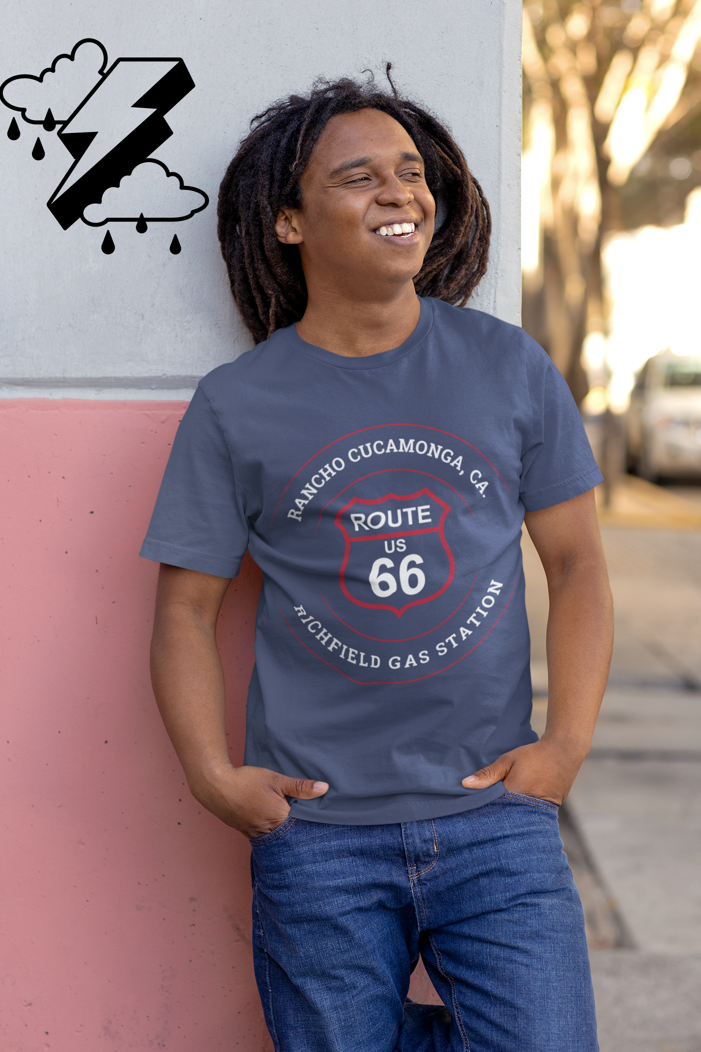 Male model wearing heather true royal retro Route 66 unisex jersey tee with Rancho Cucamonga, CA: "Richfield Gas Station" design