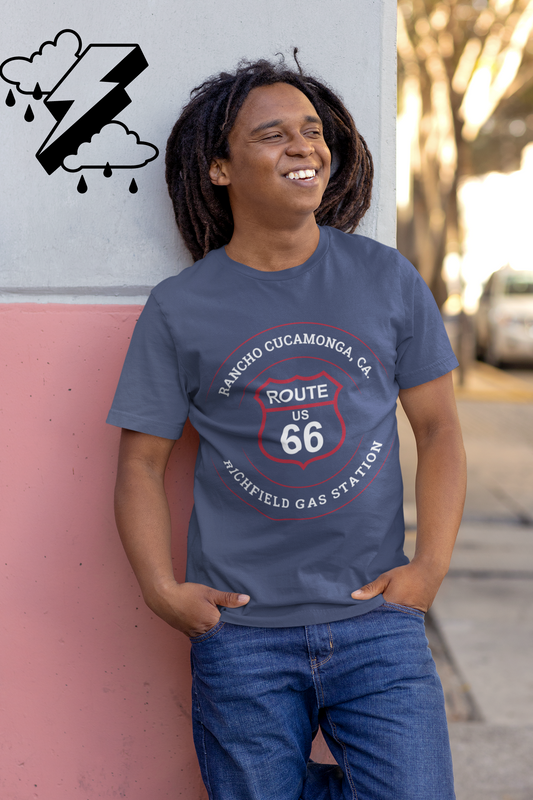 Male model wearing heather true royal retro Route 66 unisex jersey tee with Rancho Cucamonga, CA: "Richfield Gas Station" design