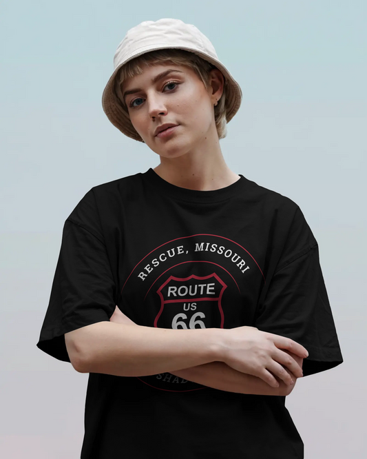 Female model wearing black retro Route 66 unisex jersey tee with Rescue, MO "Site of Shady Side Camp" design