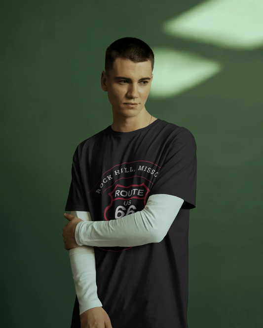 Male model wearing a black retro Route 66 unisex jersey tee with a Rock Hill, MO: "The Trainwreck Saloon" design