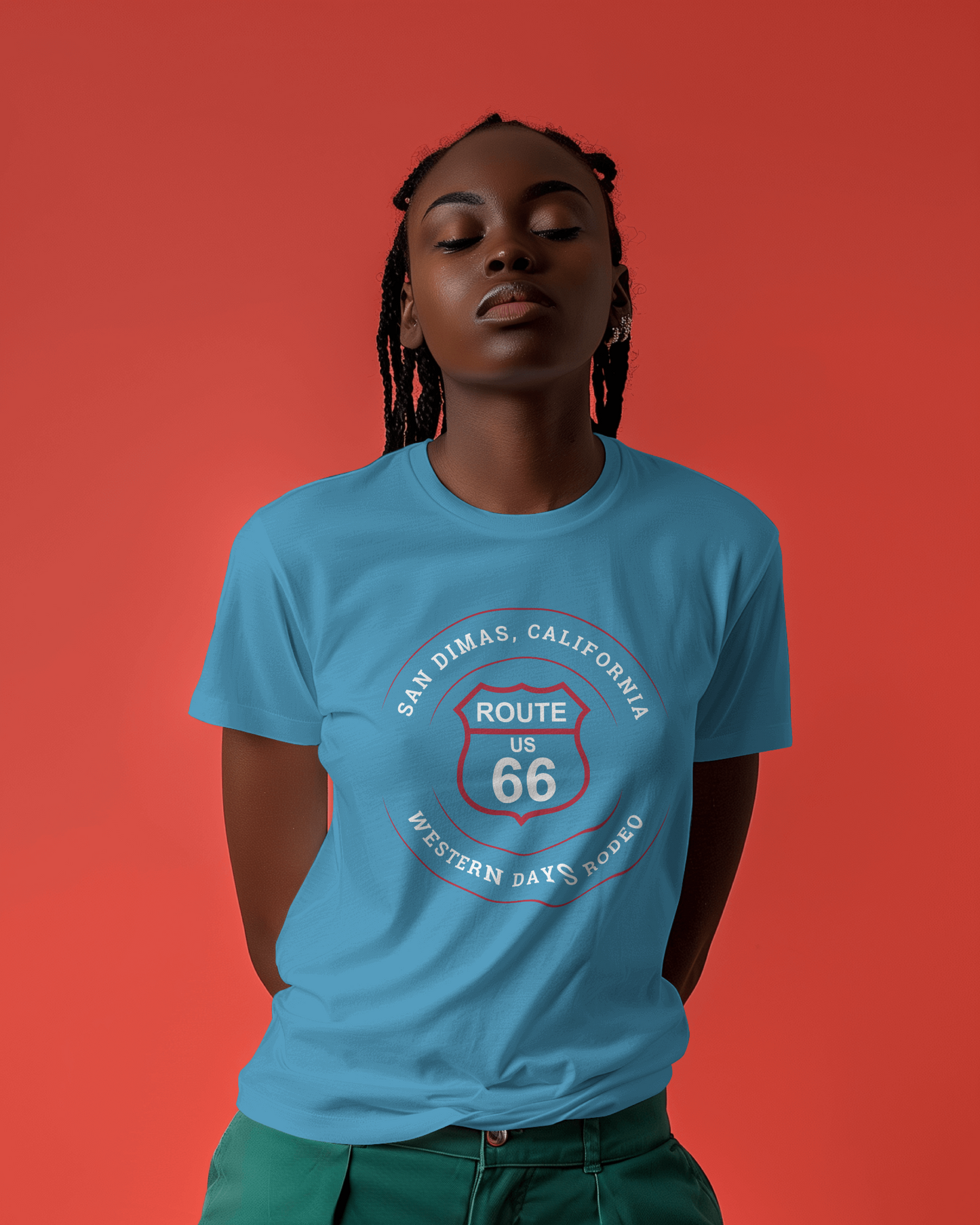 Female model wearing aqua retro Route 66 unisex jersey tee with San Dimas, CA: "Western Days Rodeo" design