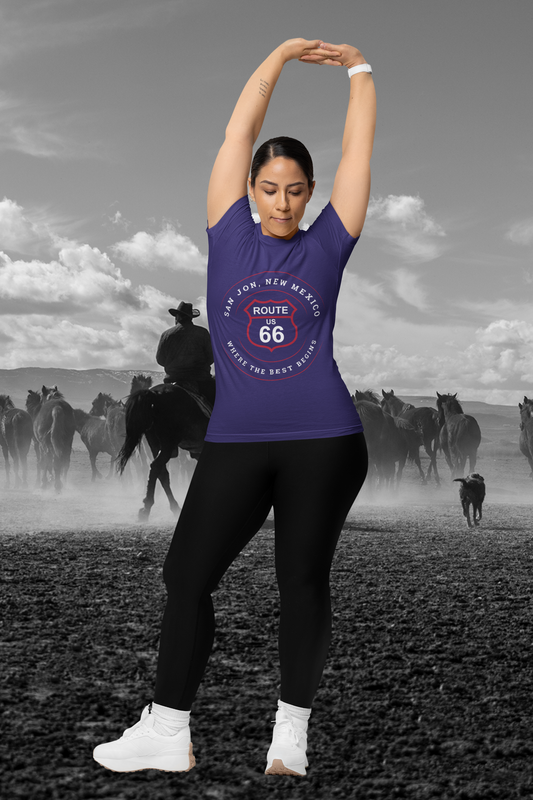 Female model wearing team navy retro Route 66 unisex jersey tee with San Jon, NM: "Where the Best Begins" design
