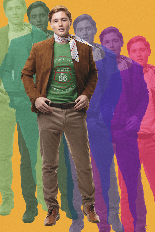 Stylish man wearing black retro Route 66 unisex jersey tee with Santa Monica, CA: "End of the Road" design with retro pop art background in rainbow colors, fashion-forwrd apparel design. 